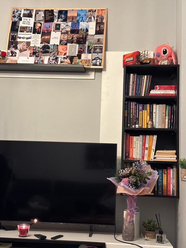 Indoor apartment scene captured in Sofia with bookshelf and laptop