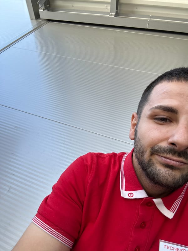 Man in red striped polo shirt observed at location
