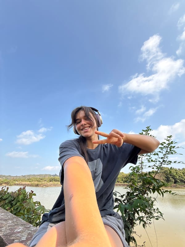 Person takes selfie in sunny residential area in Marra