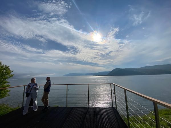 Tourists enjoy scenic Lake Baikal views in Listvyanka, Russia