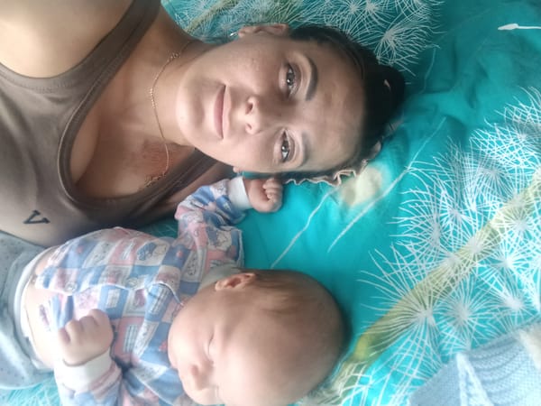 Mother and baby share quiet moments in Andreyevo home