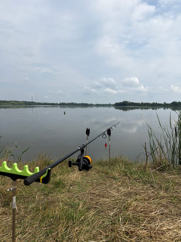 Fishing camp set up along a calm Ukrainian riverbank