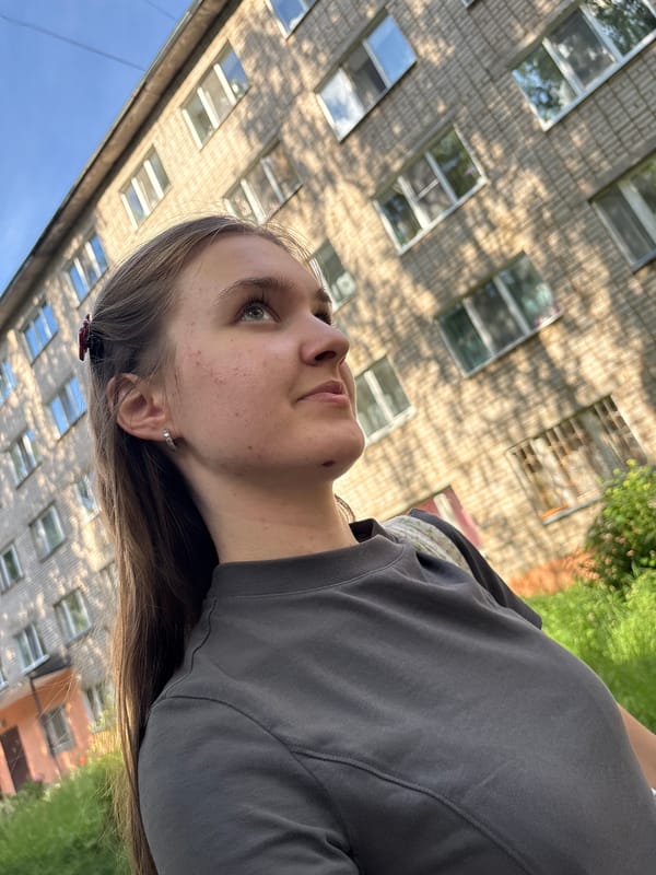 Sunny afternoon selfie session near murals in Chaikovsky
