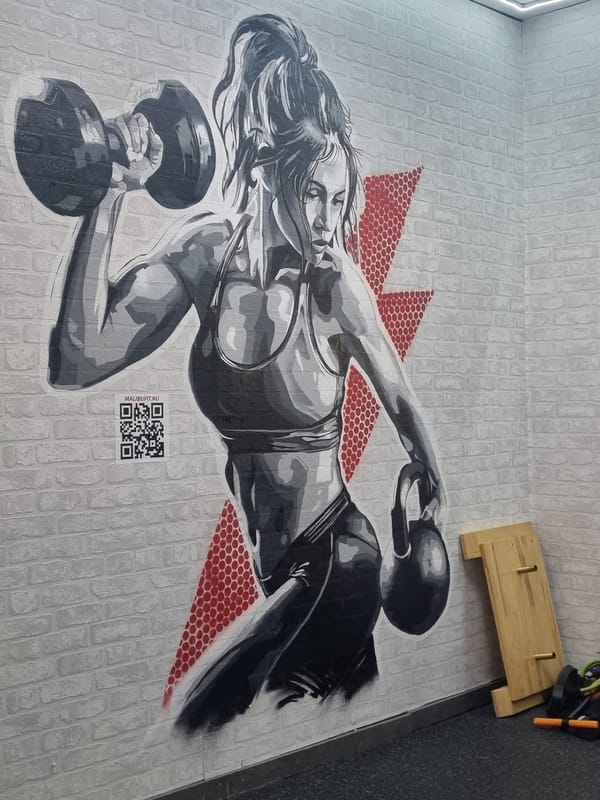 Floor artwork of weightlifting woman documented in Sochi