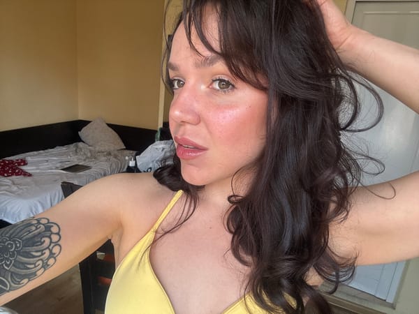 Woman in yellow top observed in Blagoevgrad hotel room