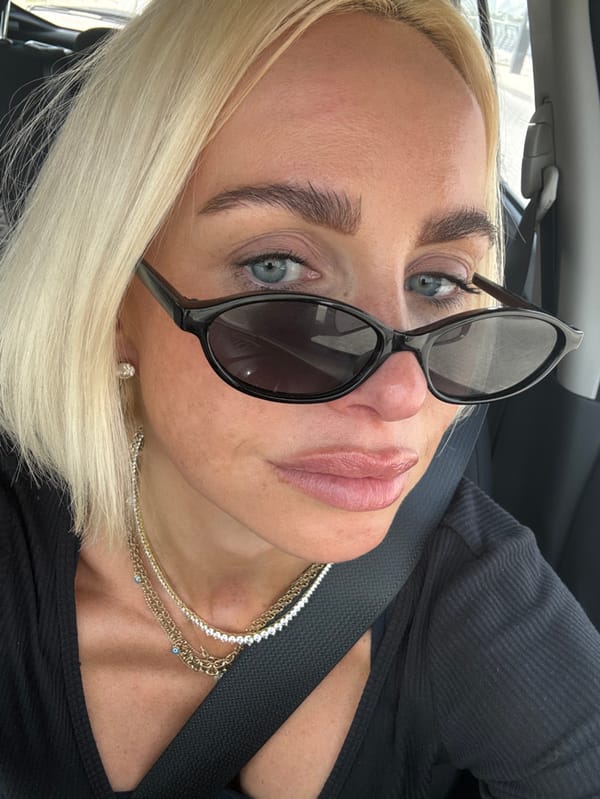 Blonde woman photographed in vehicle in Dubai