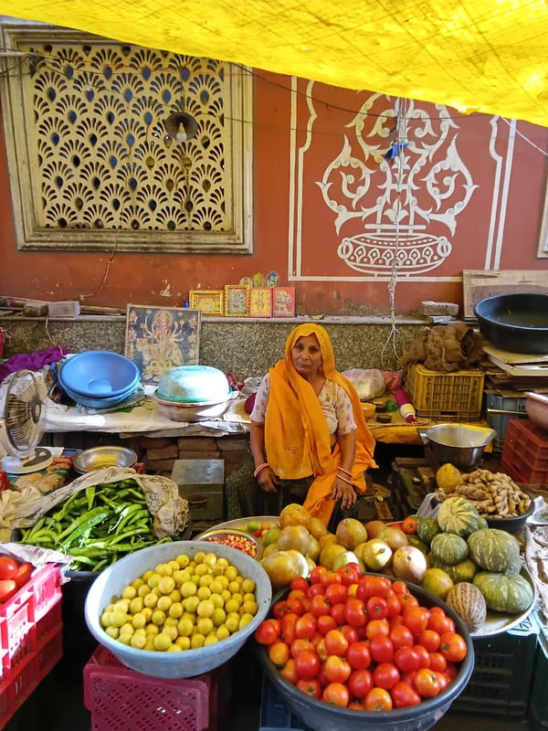 Street vendors sell fresh produce at Jaipur market