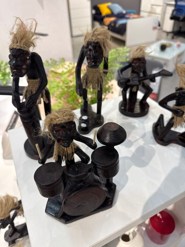 Wooden musician figurines displayed on shelf in Perm, Russia
