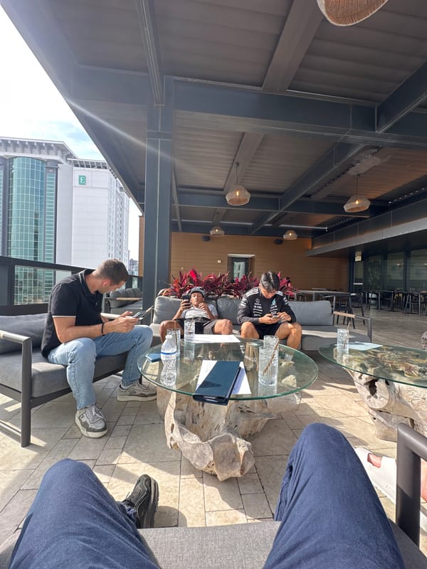Evening rooftop gathering overlooks Tampa waterfront construction activity