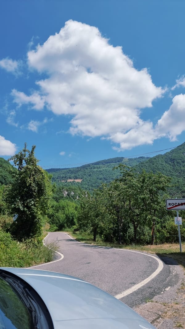 Winding road through green mountain terrain near Camprodon, Spain