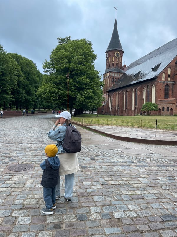 Tourist documents historic Kaliningrad walking tour around cathedral district