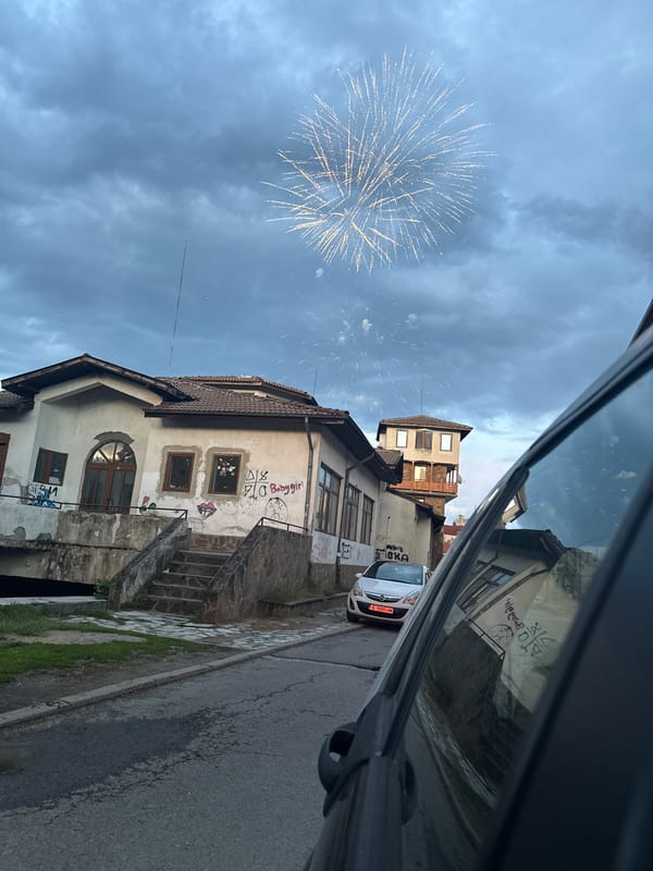 Firework spotted over weathered buildings in Razlog, Bulgaria