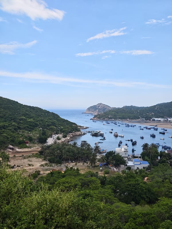 Vĩnh Hải's fishing bay full of colorful boats on a hazy morning