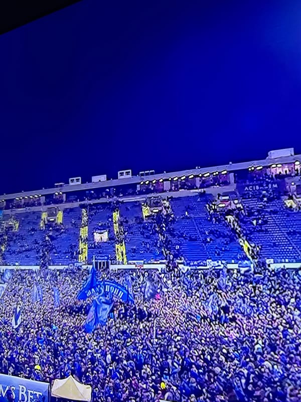 Blue-clad crowd fills Berkovitsa stadium during sporting event