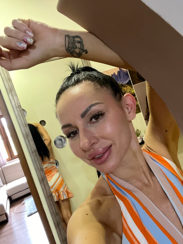 Selfie session indoors with art and printed photos in the background