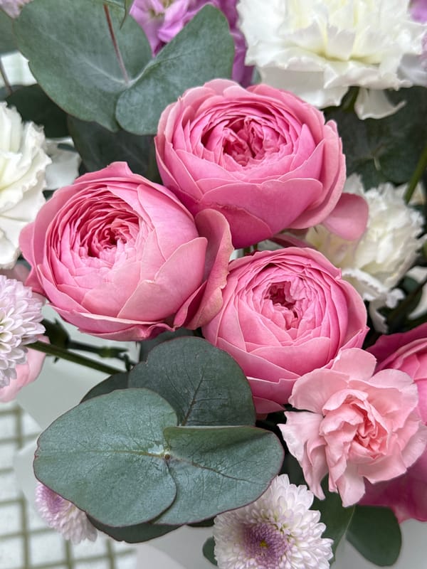 Florist arranges spring bouquets in Izhevsk flower shop