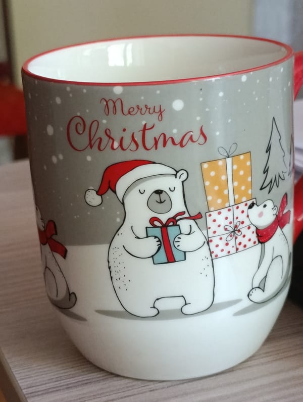 White dog naps with snowman toy amid holiday home scenes