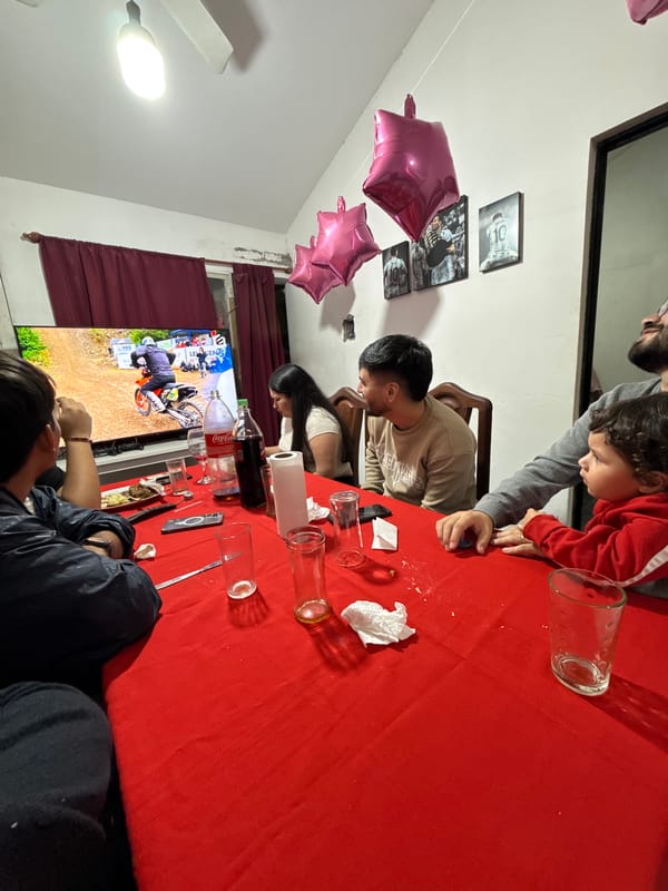 Family watches soccer game during early morning gathering in Argentina