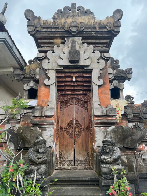 Tourist documents traditional Balinese stone architecture in Tegallalang