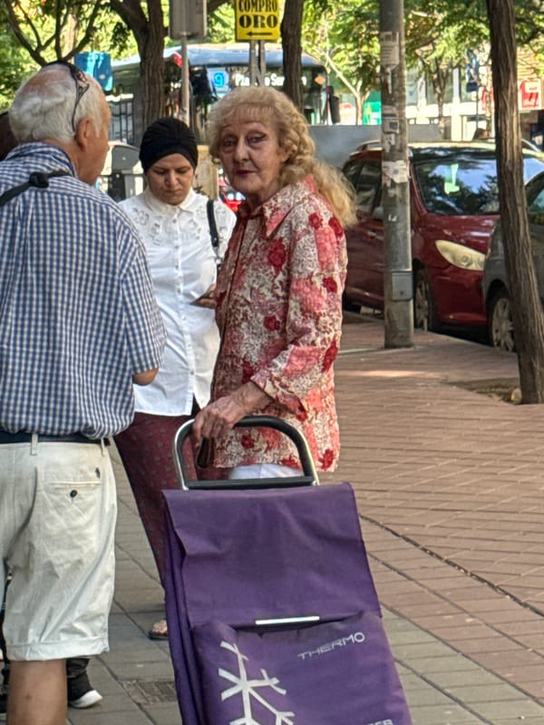 Morning market scenes with elderly shoppers and vendors documented