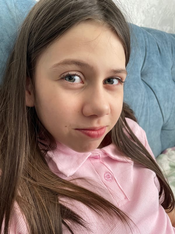 Young girl photographed resting indoors in Izhevsk