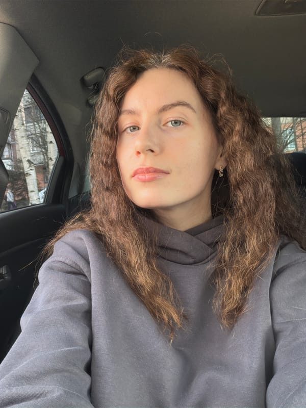Woman takes car selfies in Vsevolozhsk residential area