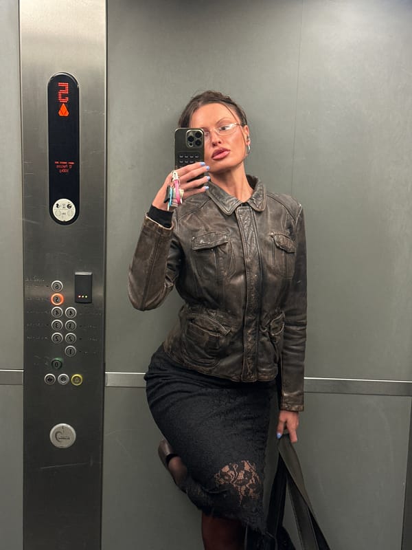 Woman takes elevator selfie in London