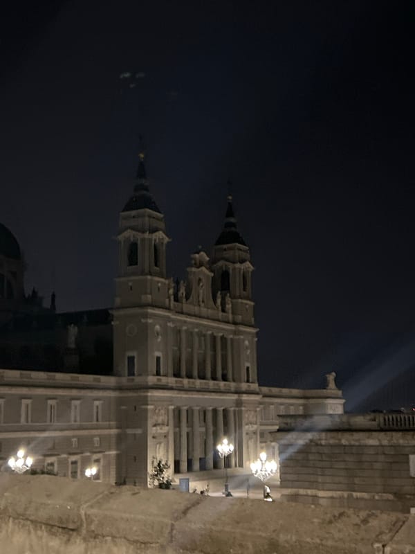 Almudena Cathedral glowing under night lights in Madrid