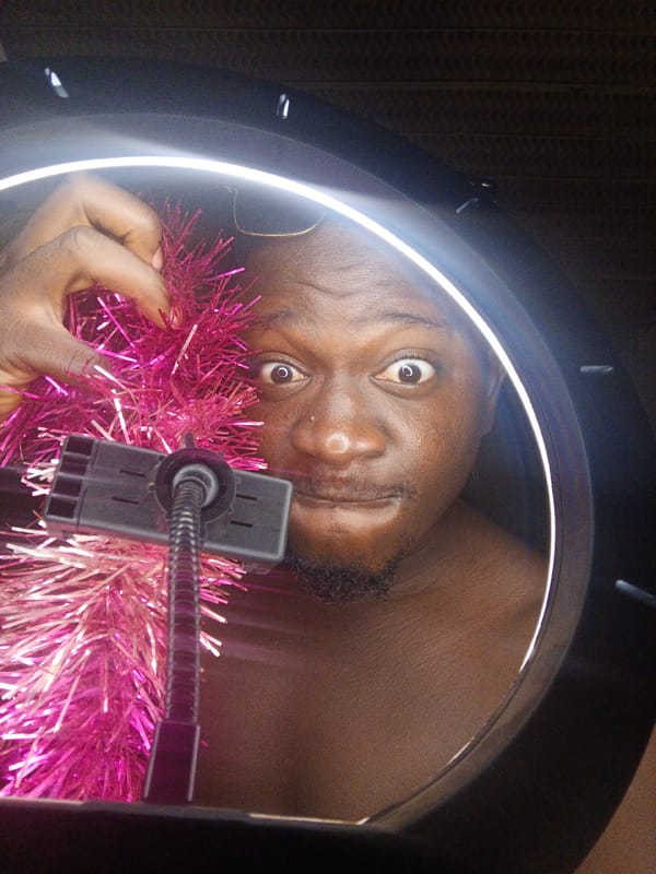 Ring light selfie session with pink props and roses