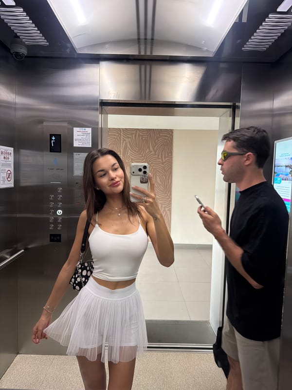 Woman takes elevator selfie in Choeng Thale, Thailand