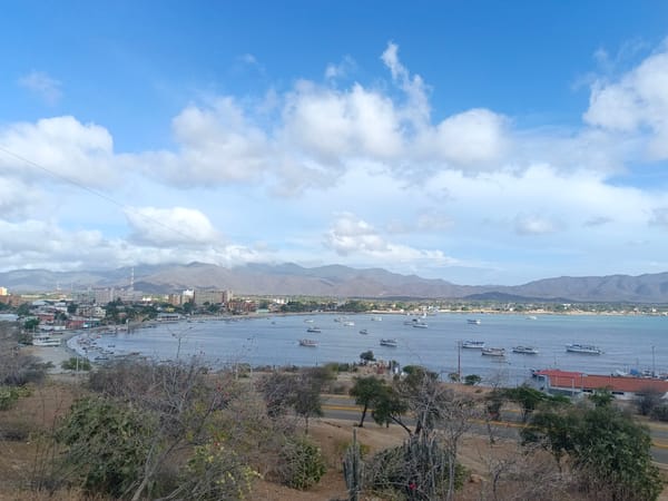 Tourist Documents Coastal Views and Infrastructure Around Juan Griego