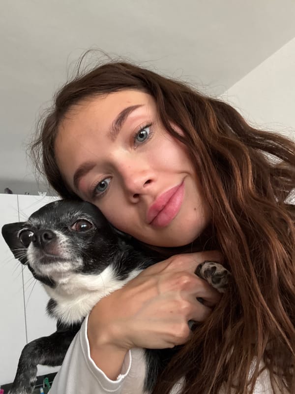 Woman poses with small dog in Ramat Gan