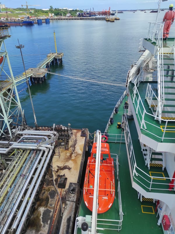 Industrial port operations with docked cargo ship