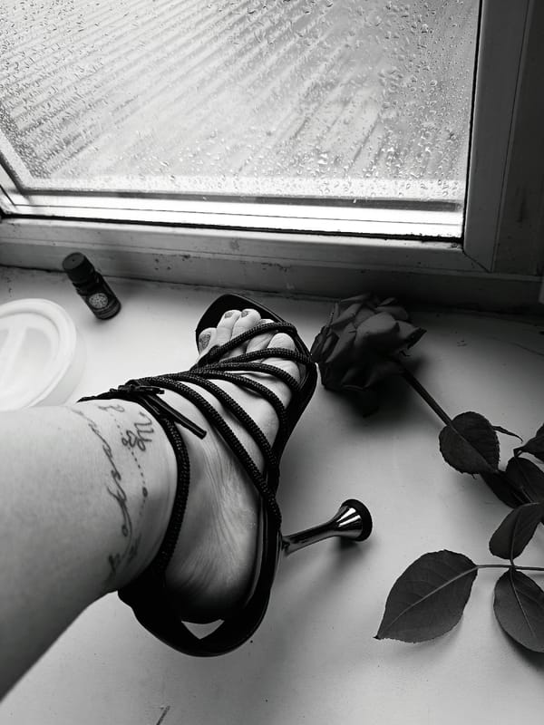 Close-up photograph captures foot on windowsill in Rusalevka