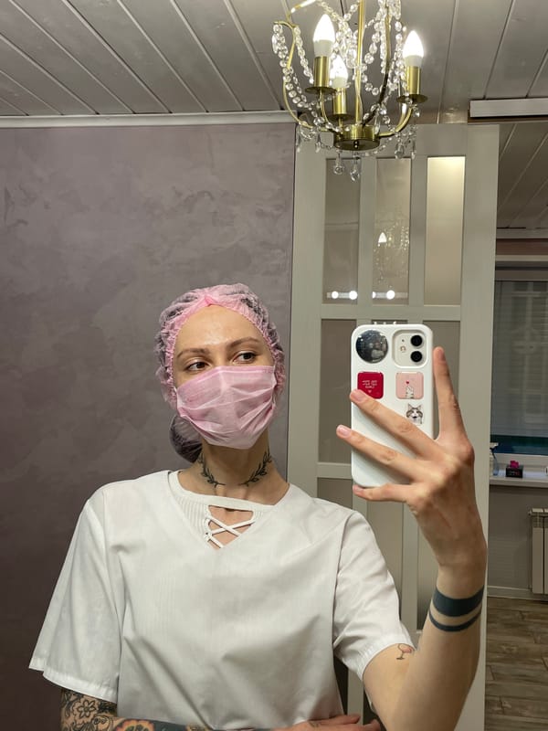 Medical worker takes mirror selfie in Izhevsk room