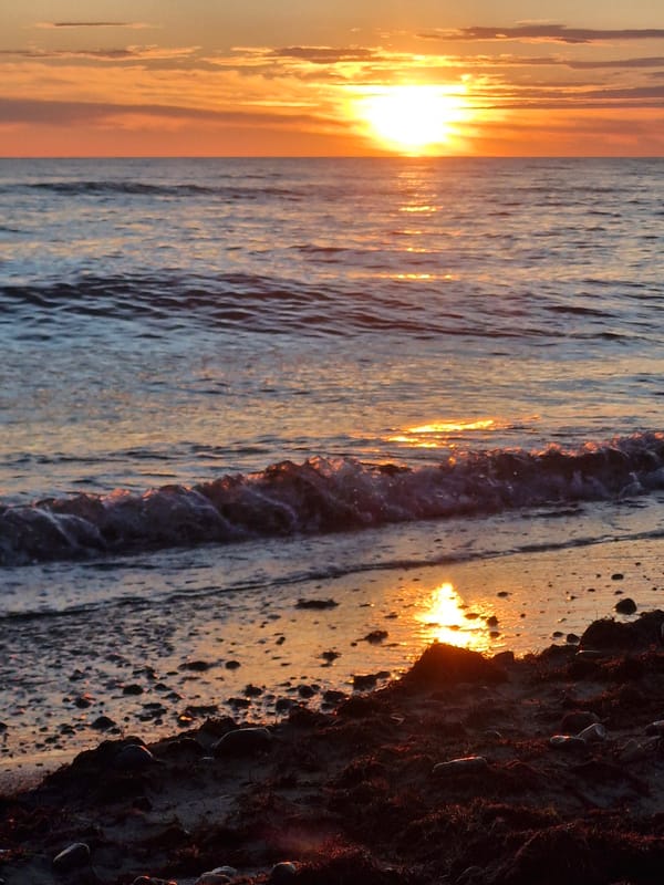 Beach sunset to dusk, waves, sea glass, and shifting skies