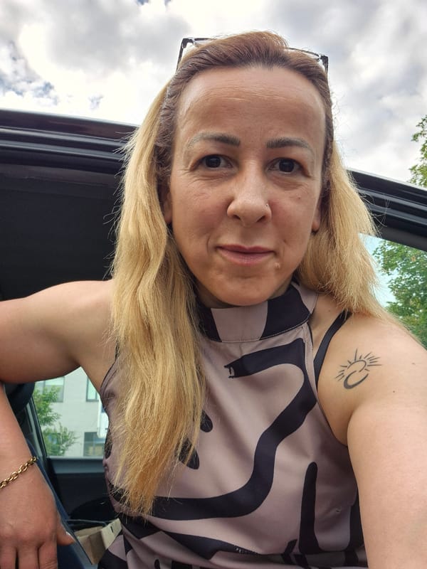 Woman photographed in multiple portraits near vehicle early morning