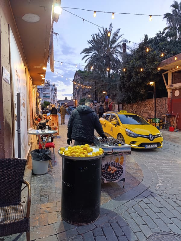 Evening stroll through historic Antalya captures cats, cobblestones, sunset