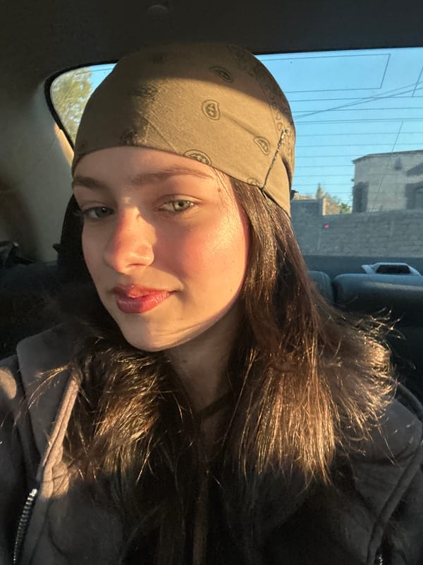 Young woman documents afternoon car journey through Yerevan selfies