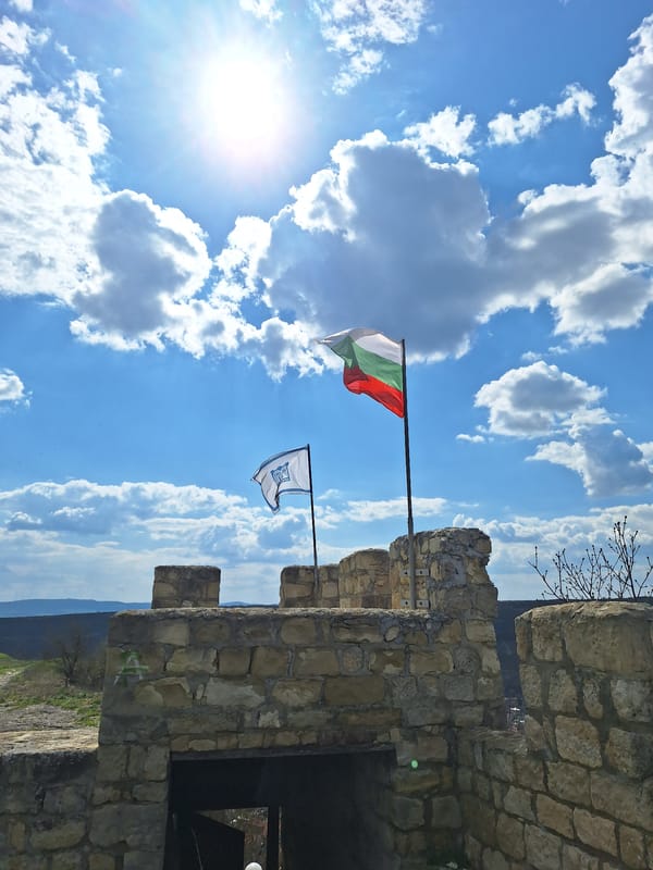 Tourist visits medieval Ovech Fortress in Bulgaria under sunny skies