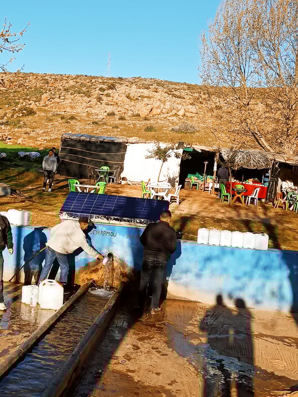 Rural Morocco communities collect water from local distribution systems