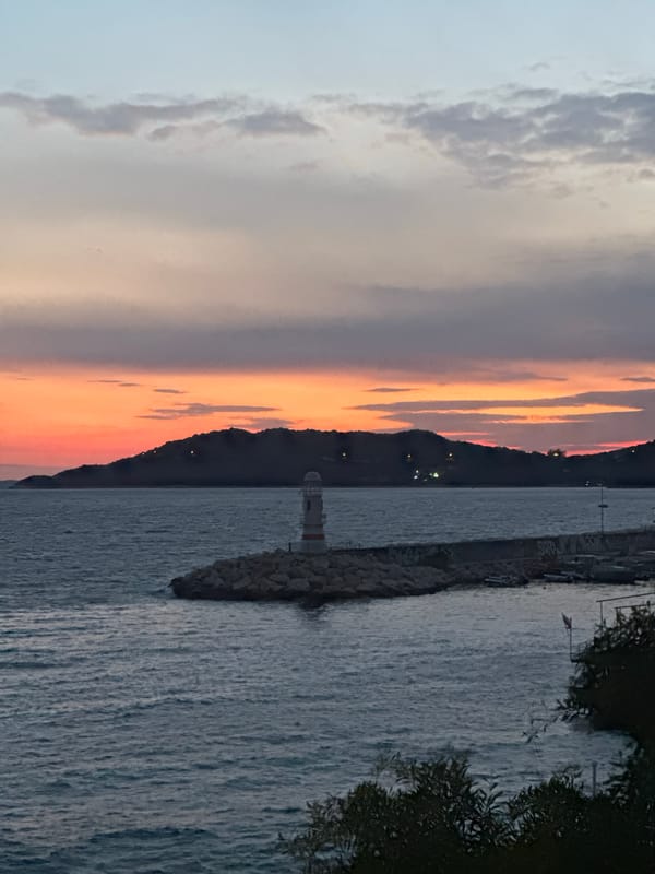 Evening sunset dinner documented in Mediterranean coastal town