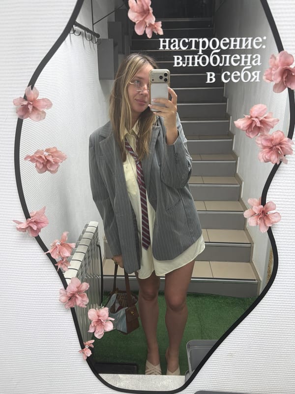 Mirror selfies in a modern Chaikovsky interior, styled in blazer and tie