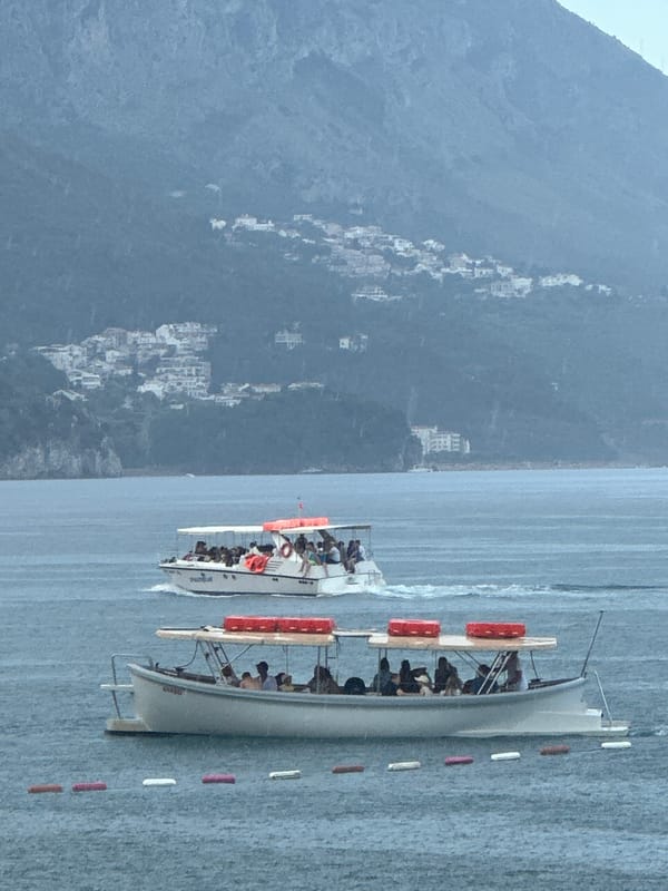 Tour boats and beach life along the Montenegro coast
