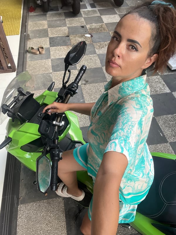 Parked on a green scooter in Kuta Selatan, Bali