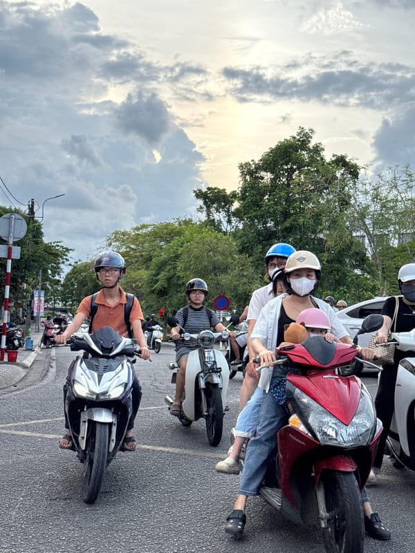 Street traffic and daily movement near Huế's Ho Chi Minh Museum
