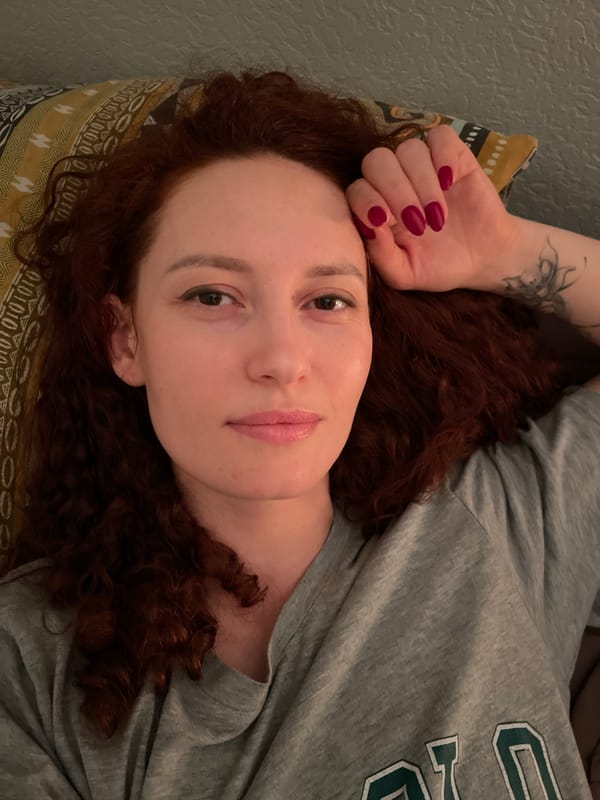 Woman rests in bed during evening hours in Saint Petersburg