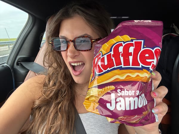 Woman poses playfully upside-down in car in Trijueque