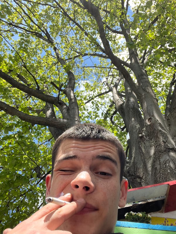 Young man smoking documented around Sopot, Bulgaria morning hours