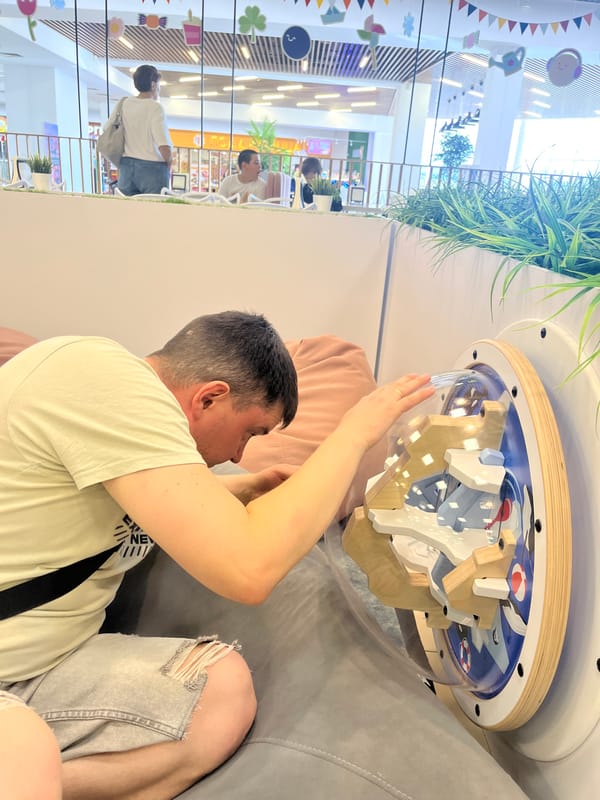 Family day at indoor children's play center documented